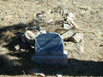 We found a 100 year old grave on the Ranch...... The Tombstone reads "Louis J. Fowler 1861-1902"........The Legend and Lore of the Ranch tells us that  Louis Fowler was shot while robbing a Bank in Westcliffe and was found in an old mineshaft on the property....... Fowler's body was carried up the hill from the mineshaft and buried where the photograph was taken........ His family put the Tombstone in place after they were told of his death and burial........