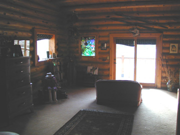The sitting area of the Master Bedroom has glass doors leading out to the front deck......
