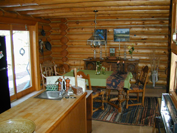 The dining room has glass doors that lead to the back deck.......