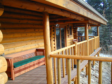 Covered front deck leads to the Master Bedroom.....