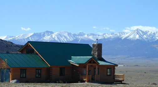 Main residence with Sangre de Cristo mountain range in the background........