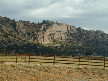 Looking East........Split Rail fences surround some of the corrals..... The entire property is fenced and cross-fenced.....