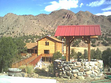 Walkway from the Barn passes the Wishing Well.......