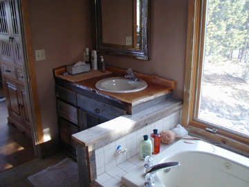 One of the 2 Bathrooms........ Barn wood was used for the cabinets and counter tops........
