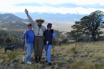 Blue Heeler - "Dot" watches Arthur Vyn Boennighausen of RE/MAX and the owners pose for their photographs........